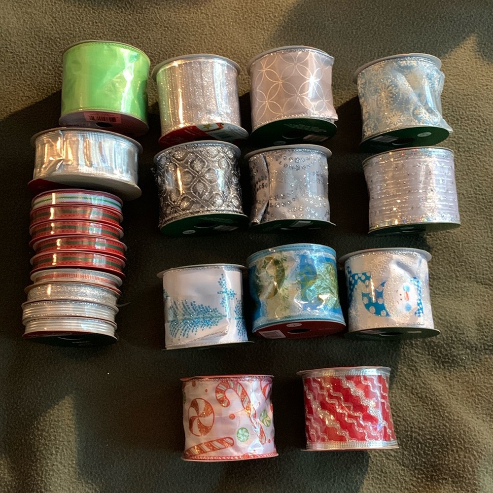 Lot of 22 new Christmas ribbon rolls. Various sizes, colors and patterns.